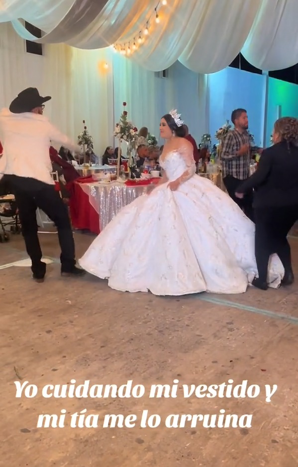 tía pisa vestido de sobreia en boda